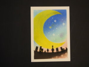 渡良瀬橋から見た、大きな月と星のパステル画の写真です。