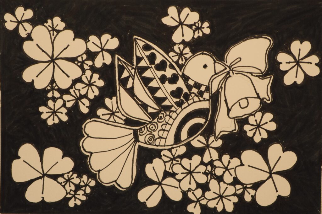 モノクロアート：鳥と花の写真です。